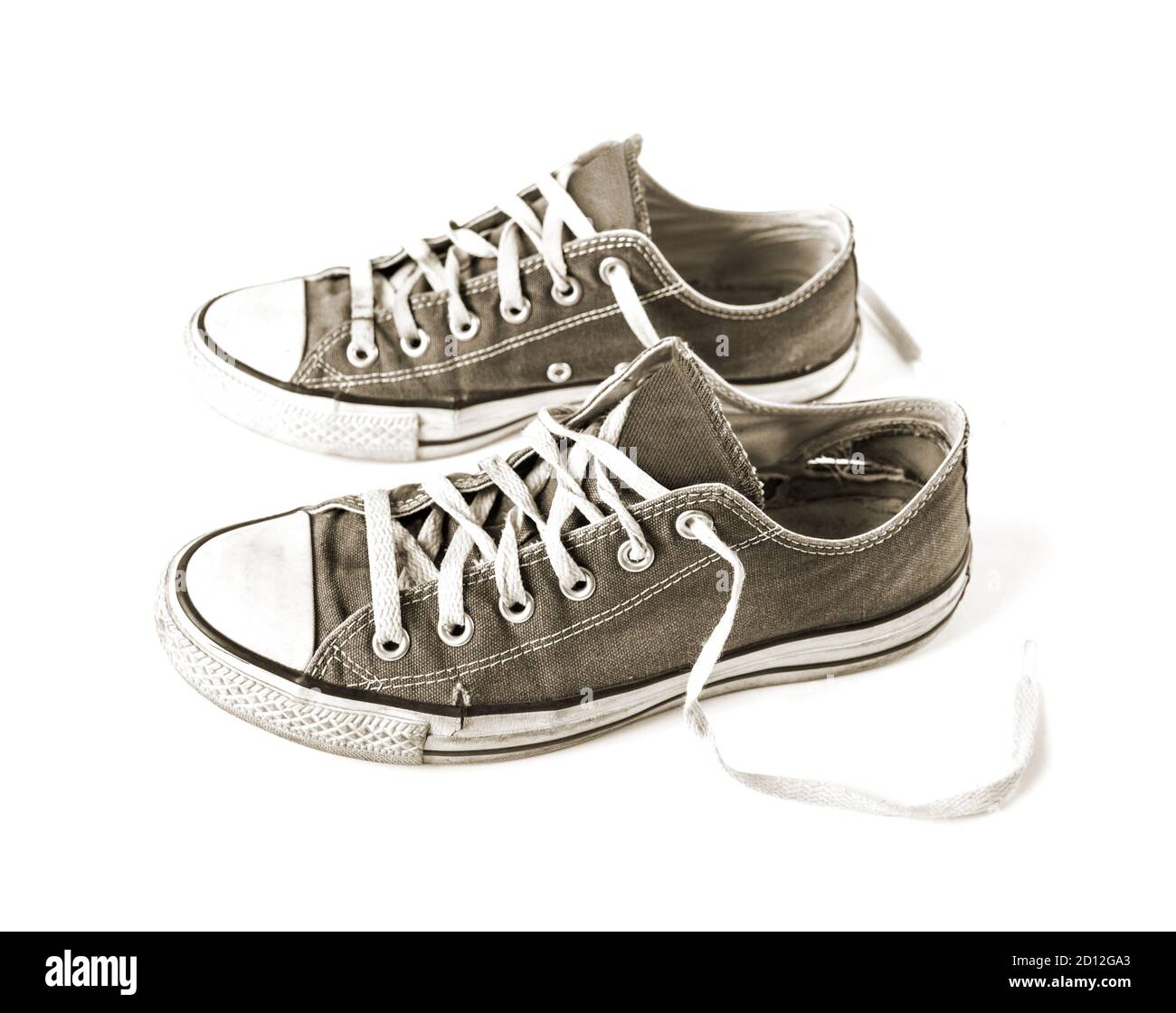 Old black generic sneakers isolated on white background Stock Photo - Alamy