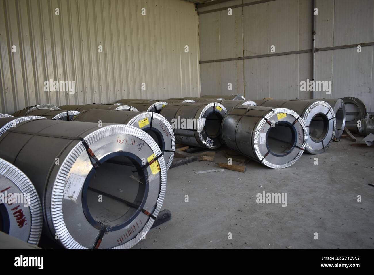 Rolls of steel sheet stored in warehouse; galvanized steel coil in the