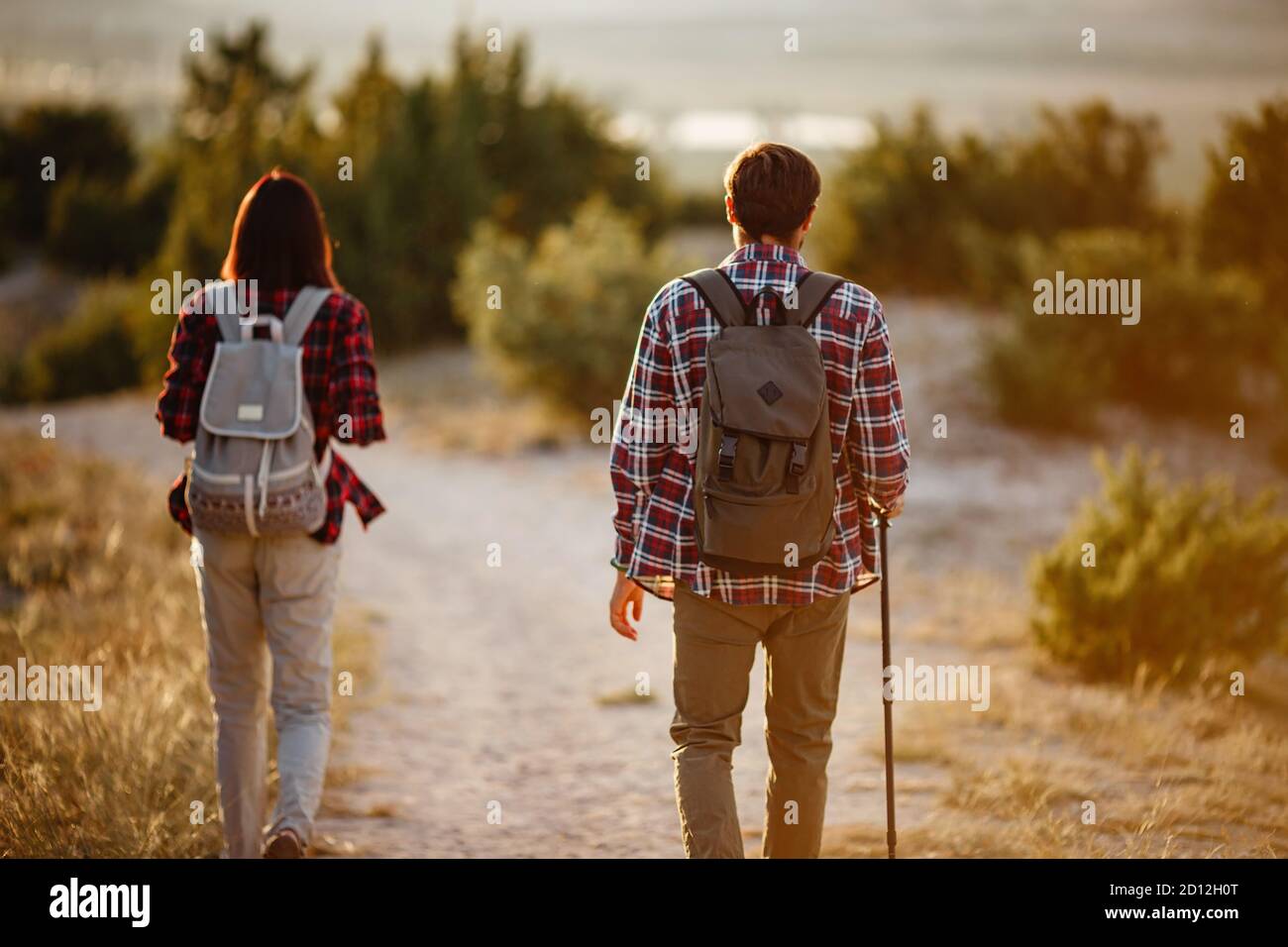 Portrait of happy young couple having fun on their hiking trip ...
