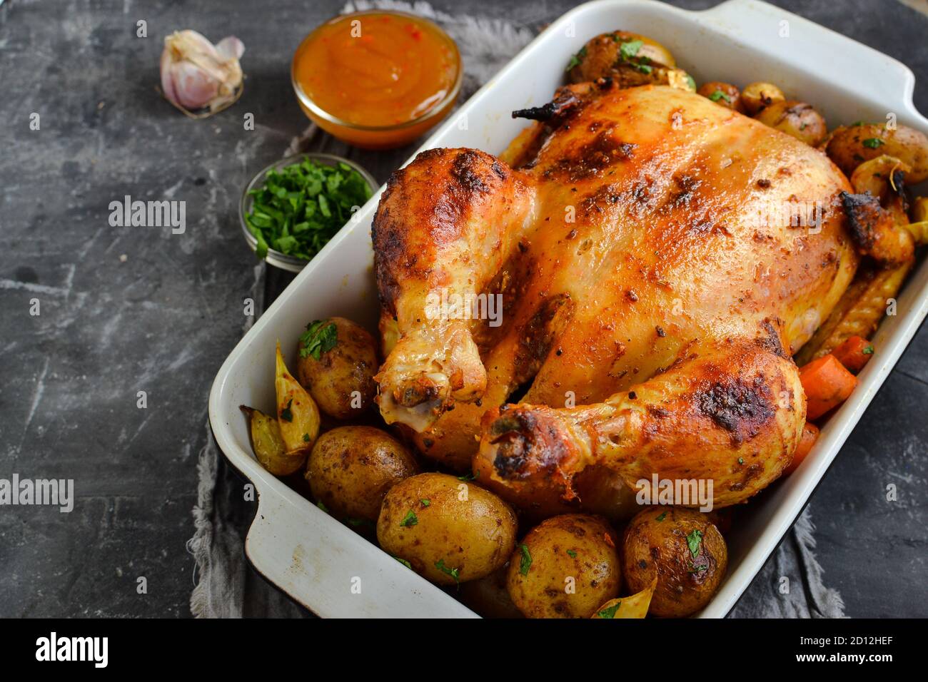 Whole baked chicken. Free space for text. Grey background. Chicken with