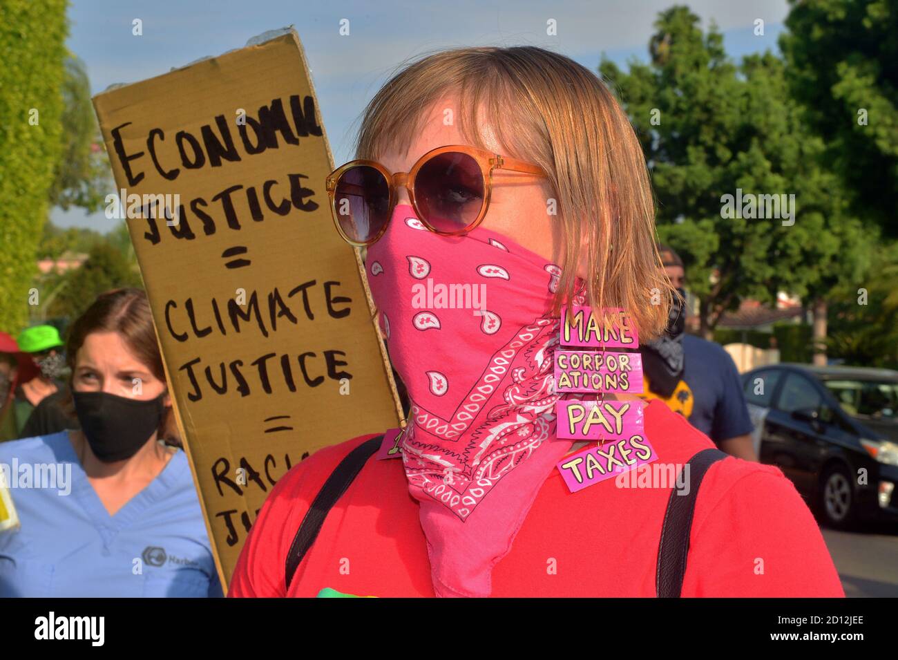 Beverly Hills, California, USA. 4th Oct, 2020. A coalition of labor and environmental activists protest outside Amazon founder Jeff Bezo's mansion in Beverly Hills, California on Sunday, October 4, 2020. Rally organizers called on Amazon to be 'transparent and honest about the number of (COVID-19) cases they have in their facilities'' and asking that buildings or locations that have positive cases be shut down, professionally sanitized, and remain closed for a minimum of 14 days with full pay for all affected employees. Photo by Jim Ruymen/UPI Credit: UPI/Alamy Live News Stock Photo