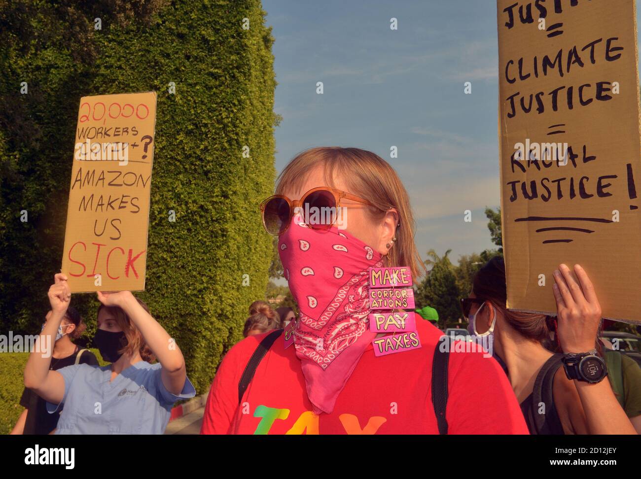 Beverly Hills, California, USA. 4th Oct, 2020. A coalition of labor and environmental activists protest outside Amazon founder Jeff Bezo's mansion in Beverly Hills, California on Sunday, October 4, 2020. Rally organizers called on Amazon to be 'transparent and honest about the number of (COVID-19) cases they have in their facilities'' and asking that buildings or locations that have positive cases be shut down, professionally sanitized, and remain closed for a minimum of 14 days with full pay for all affected employees. Photo by Jim Ruymen/UPI Credit: UPI/Alamy Live News Stock Photo