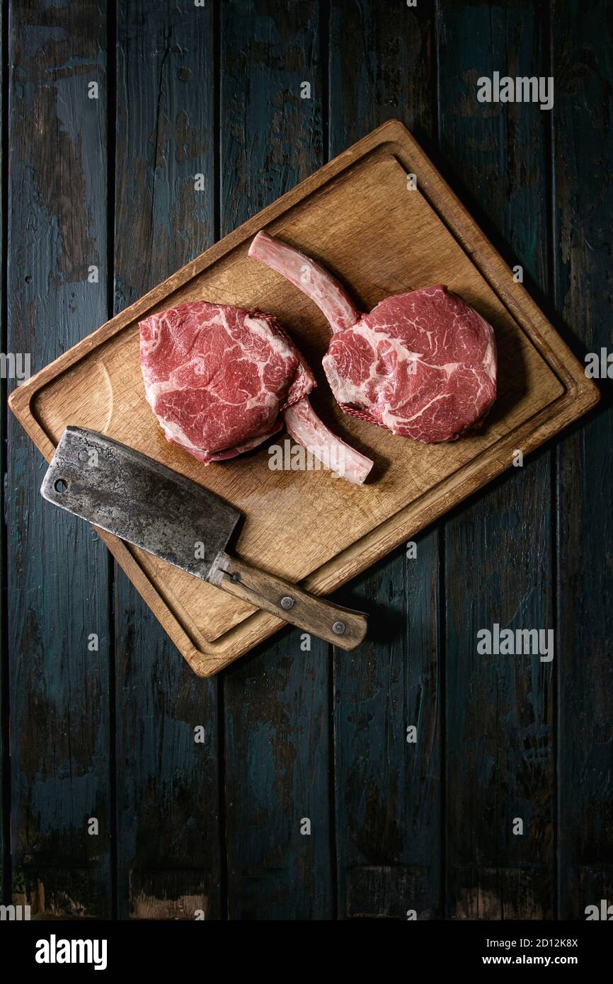 Asian butcher chopping raw meat on a cutting board Stock Photo - Alamy