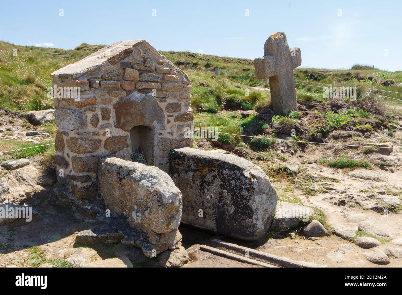 Fountain and cross of Saint Samson chapel on the coast of Brittany ...