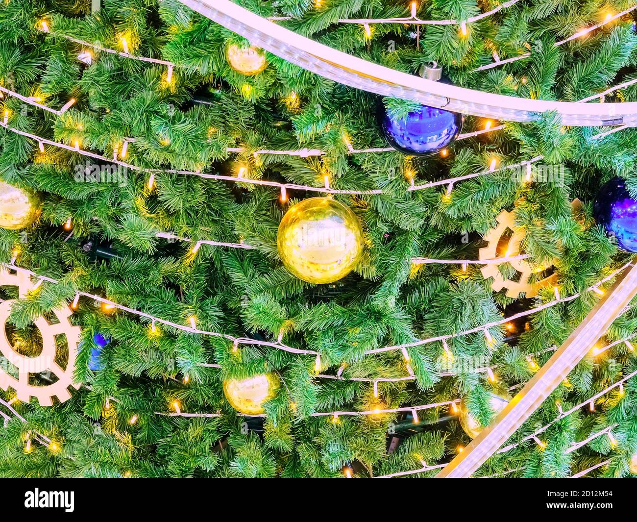 Background texture Christmas tree decorated with garlands and golden ...