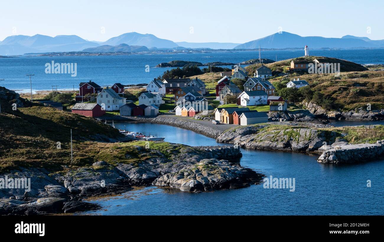 View of Husøya from the lighthouse on top of the Onakalven rock on neigbouring island of Ona. Stock Photo