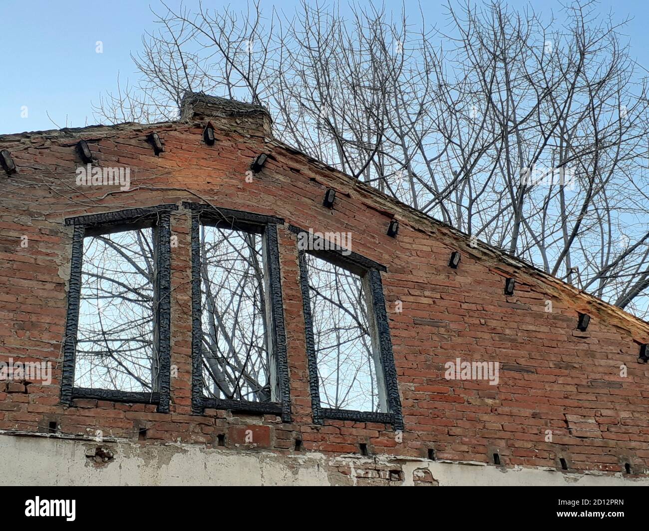 Old brick wall of a house with windows Stock Photo - Alamy