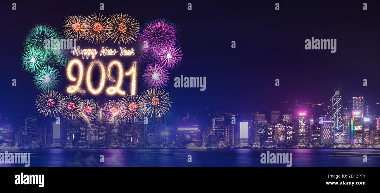 Happy new year 2021 firework over cityscape building near sea at night time celebration,mock up Banner for advertise on social media Stock Photo