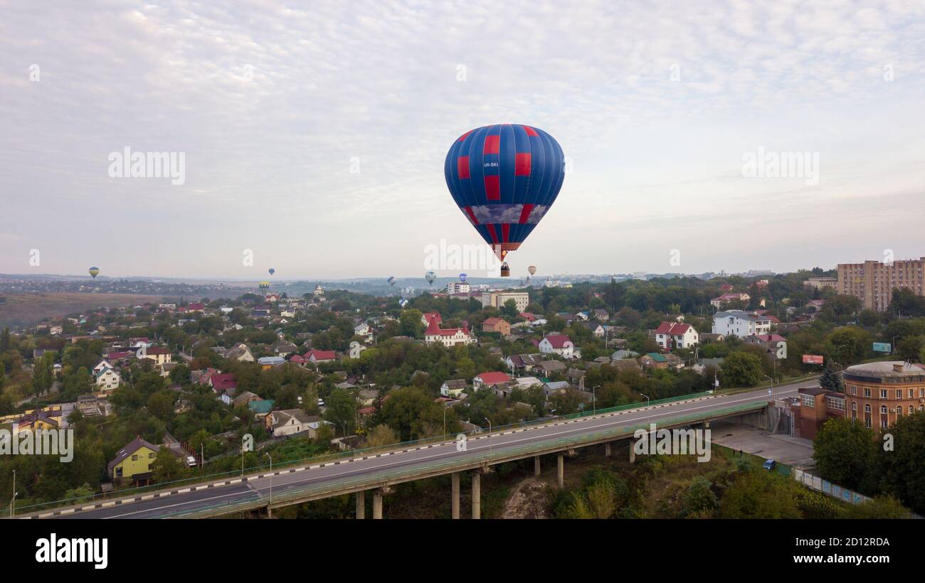Ukraine October 3, 2020, Kamyanets Podolsk Balloon Festival, morning launch. Cloudiness Flying over the bridge to the old town Stock Photo