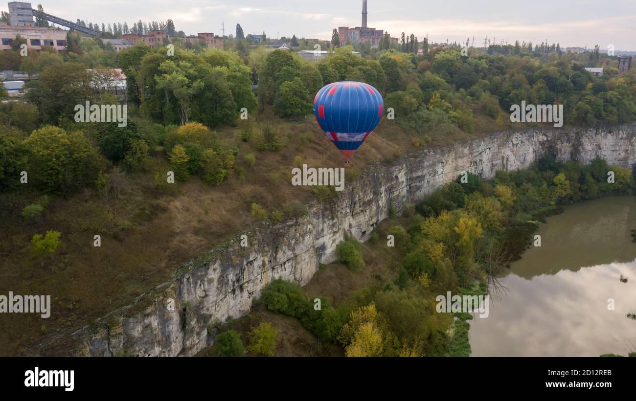 Ukraine October 3, 2020, Kamyanets Podolsk Balloon Festival, morning launch. Dangerous situation, the ball flew low, almost touching the canyon cliff Stock Photo