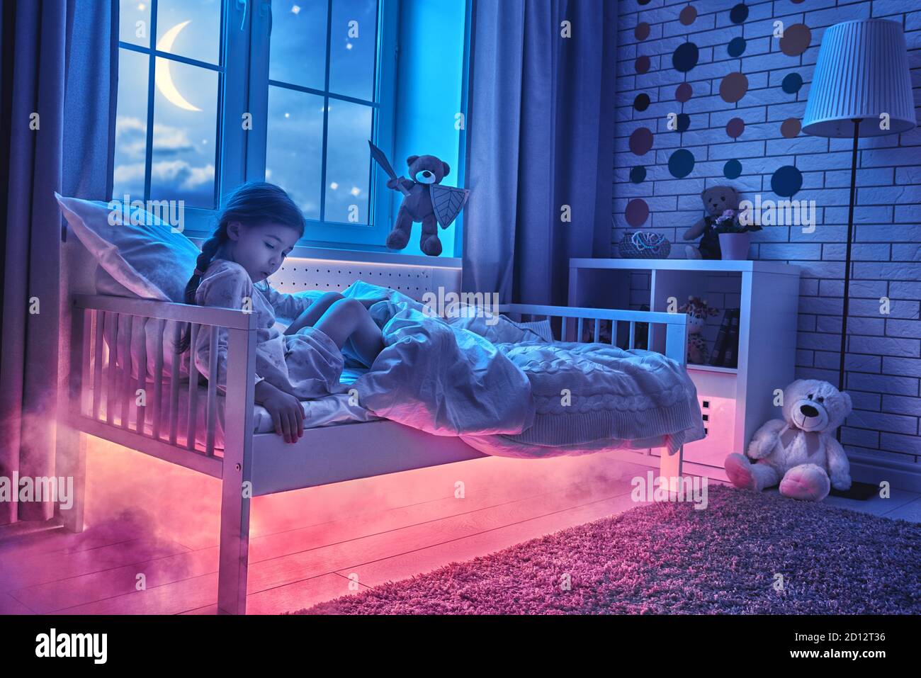 Nightmare for children. Little child girl is afraid of monsters in the