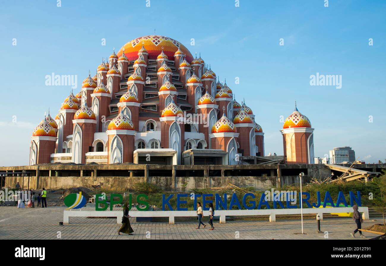 MAKASSAR, SULAWESI / INDONESIA: Detail of the bright orange-and-white Asmaul Husnah 99 Kubah mosque (99-domed mosque), the newest mosque in Makassar. Stock Photo