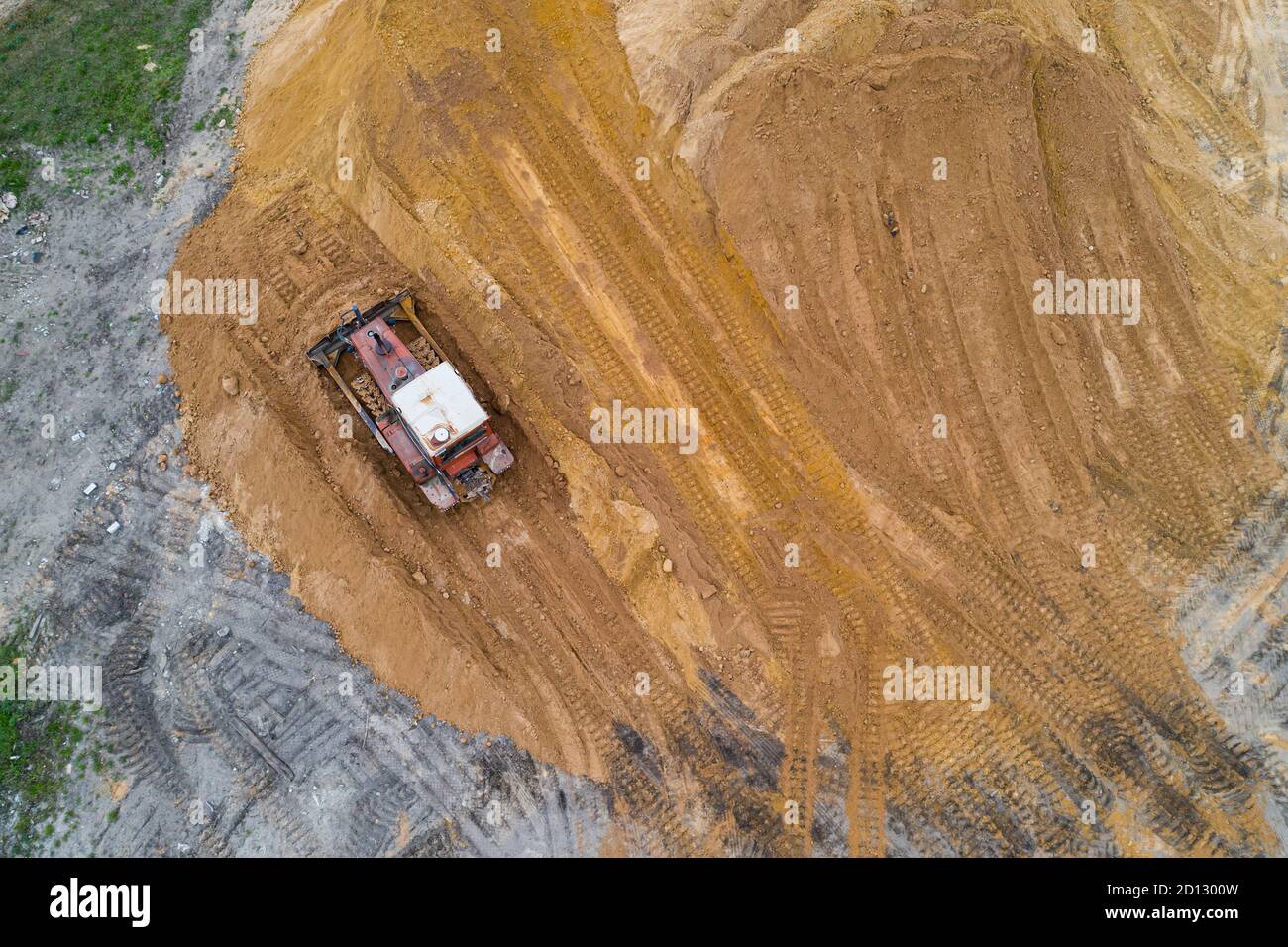 Aerial top view yellow excavator hi-res stock photography and images ...