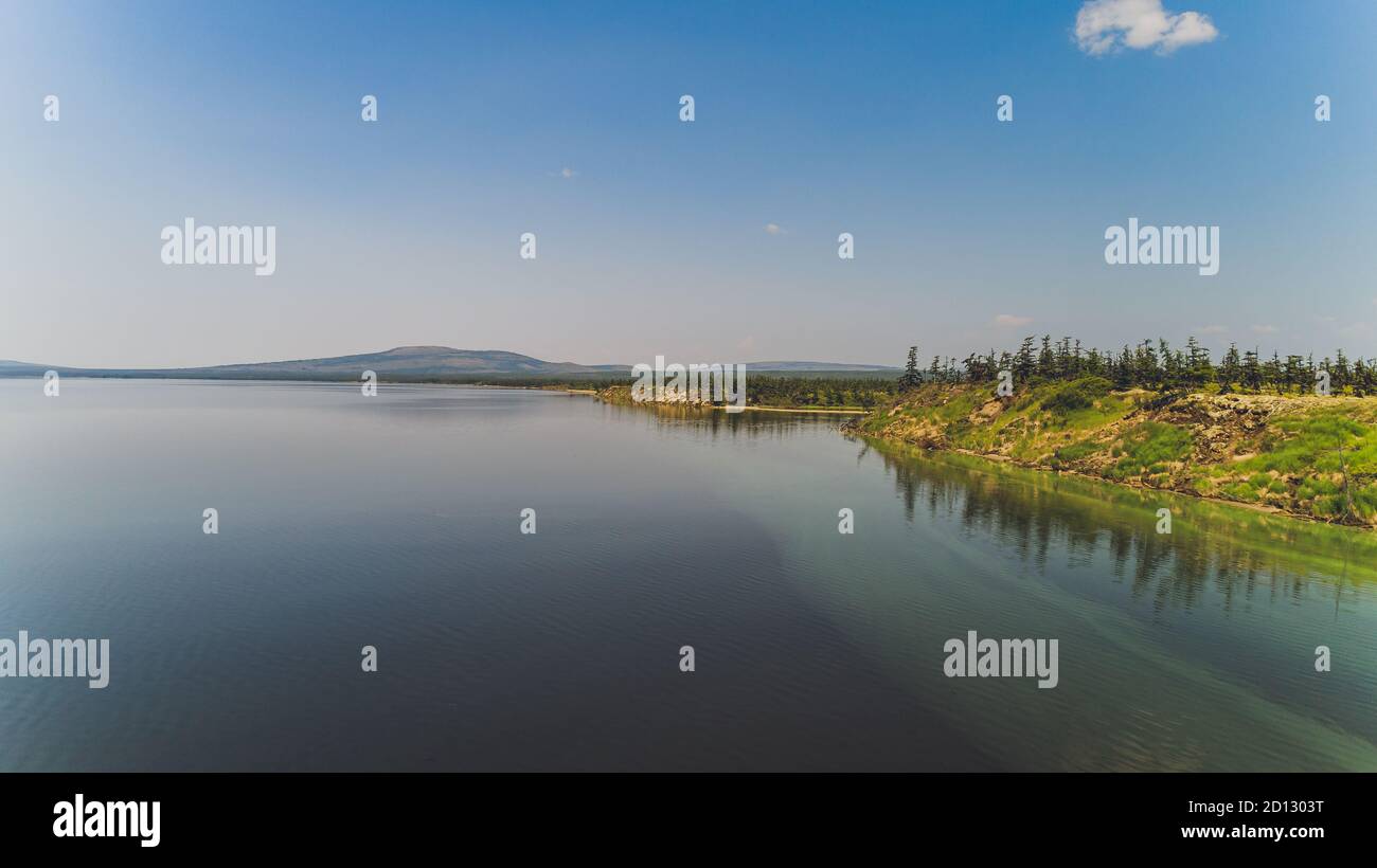 Sea bay surrounded by mountains. Peninsula Kony. The Sea of Okhotsk. Magadan Region. Russia. Stock Photo