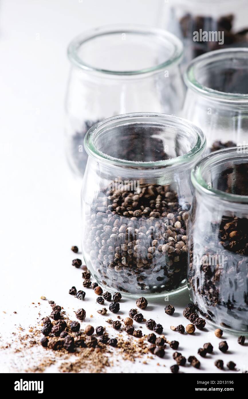 Variety of different black peppers allspice, pimento, long pepper