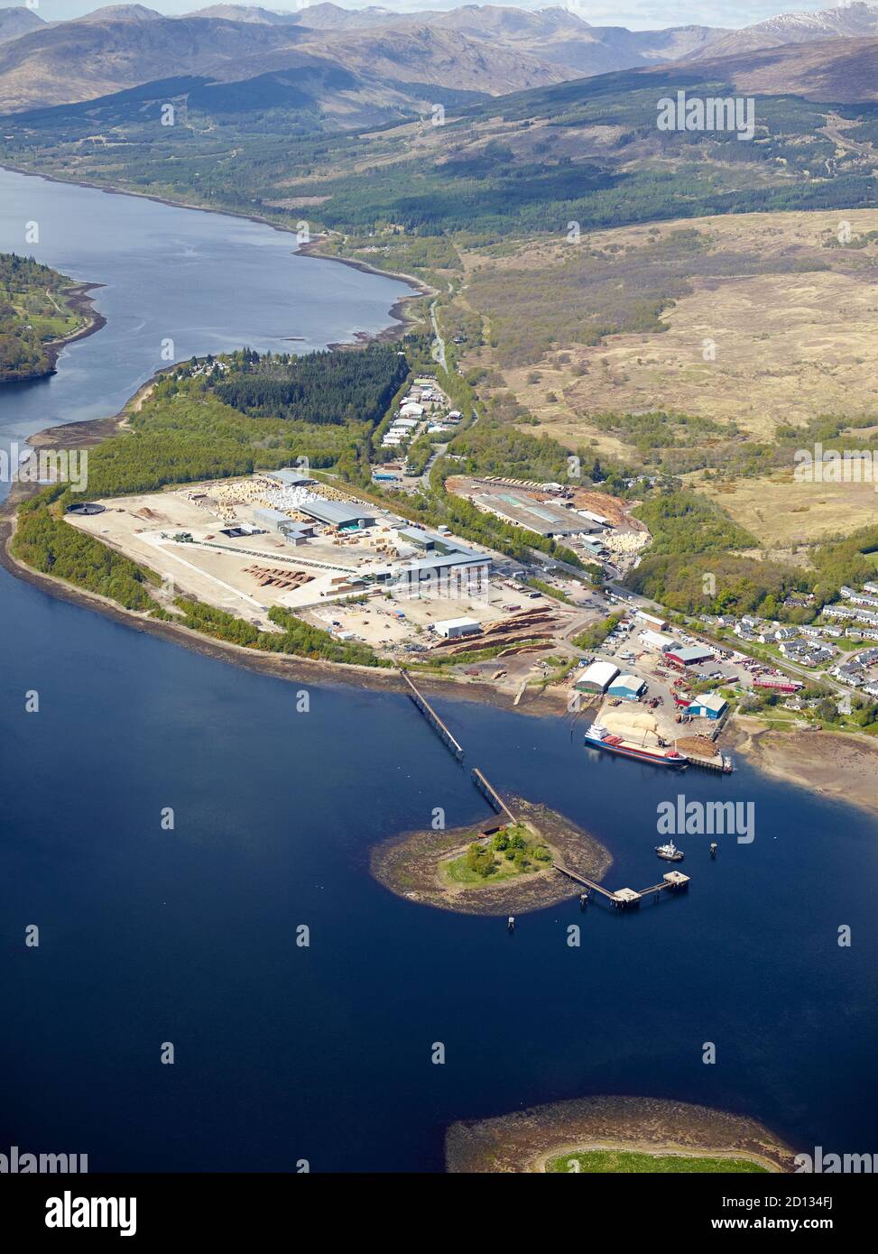 An aerial view of a timber production facility on the shore of Loch Eil, Corpach, near Fort William, Highland Scotland, UK Stock Photo