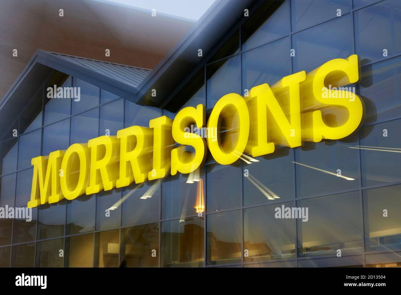 Morrisons supermarket sign, lit up, at, Bargoed, south Wales, UK Stock Photo