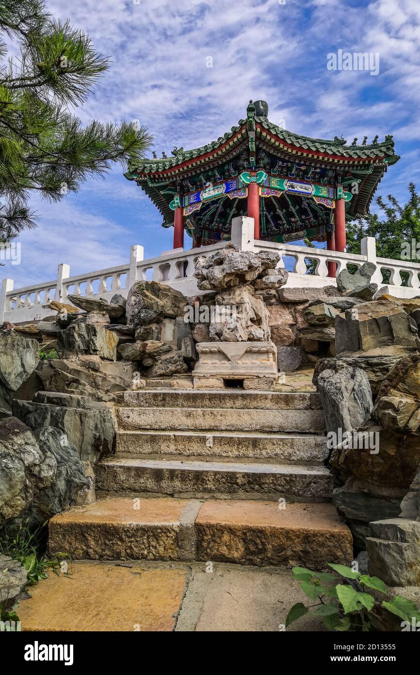 Vertical shot of a Chinese pavilion on a hill in a Ritan public park in Beijing, China Stock Photo
