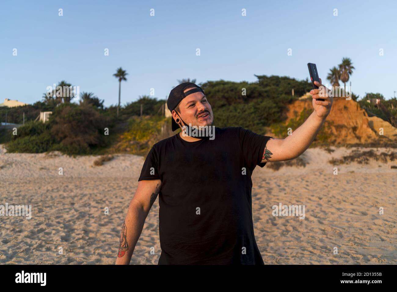 Happy black man shirt cap hi-res stock photography and images - Alamy