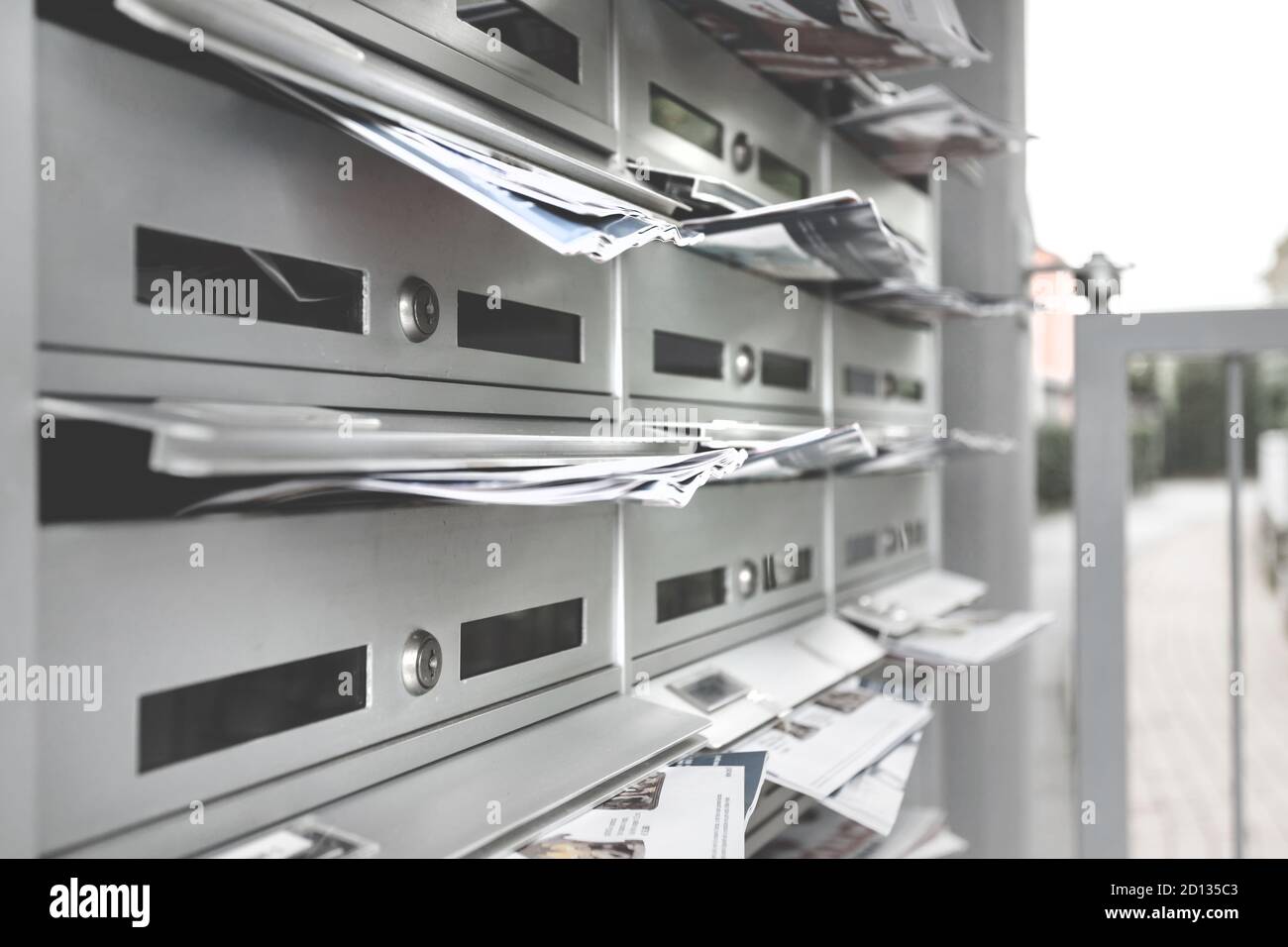 Modern mailboxes filled of flyers. Business and advertising concepts