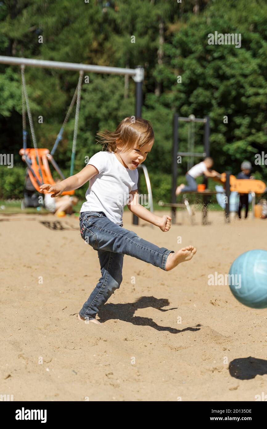 emotional child kicks the ball. summer vacation concept. children's