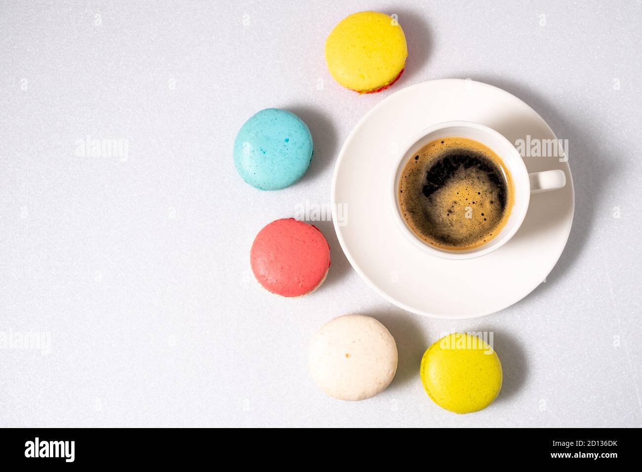 Coffee and macaroons on a white background. View from above. Stock Photo