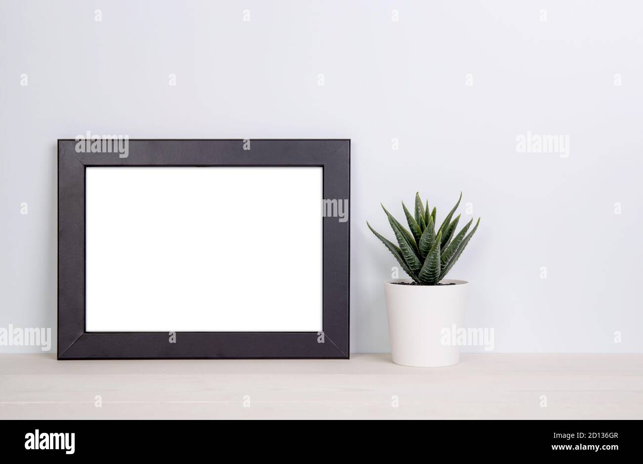 Mockup frame and plants in pot on table top at home, mock up poster for ...
