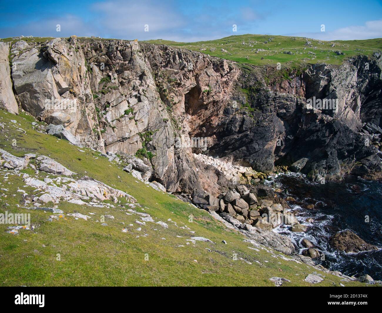 Eroded sea cliffs on the west coast of Kettla Ness off the west coast of Mainland, Shetland. These rocks are of the Colla Firth Permeation and Injecti Stock Photo