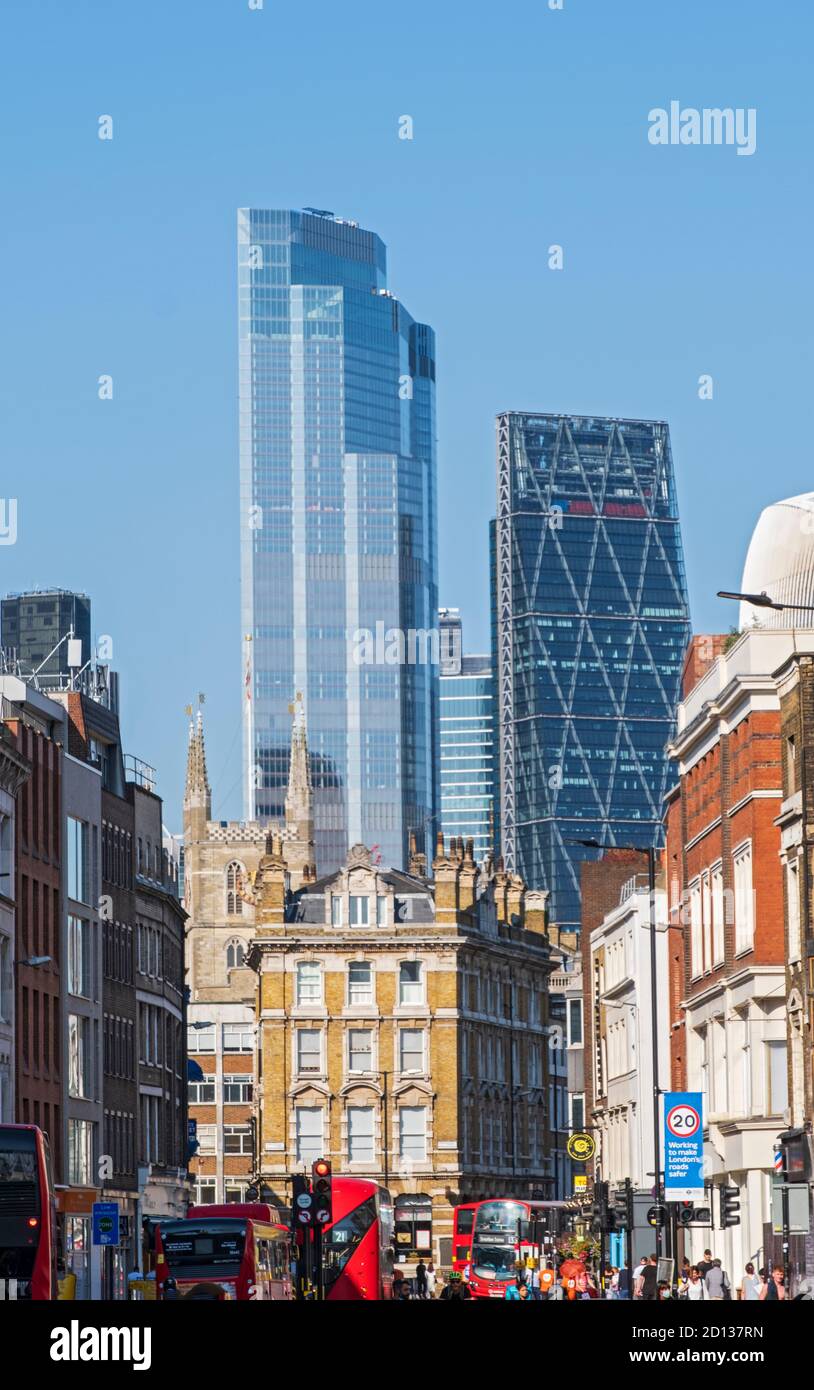 Buses on Borough High St at Southwark St, with Southward Cathedral & the Leadenhall Bldg & 22 Bishopsgate towers in the City of London CBD, summer day Stock Photo