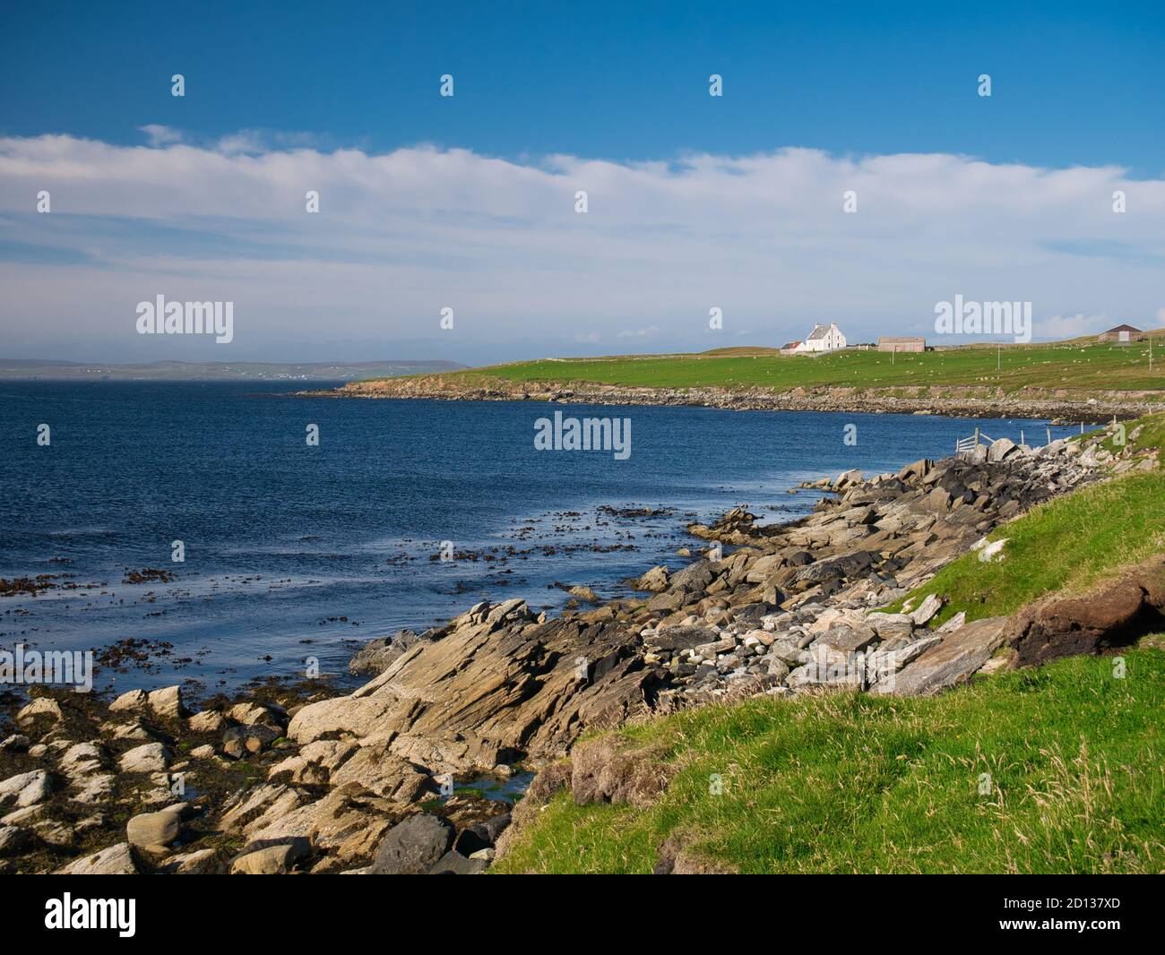 The deserted rocky bay near Outrabister on Lunna Ness, Shetland, Scotland, UK, taken on a  calm, sunny day in summer Stock Photo
