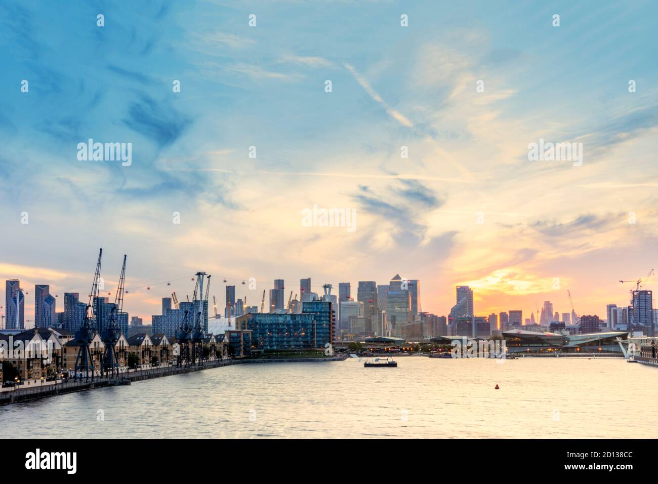UK, London, Docklands. Central Business District from East London, showing Royal Victoria Docks, O2 Millennium Dome & the Emirates Cable Car Stock Photo