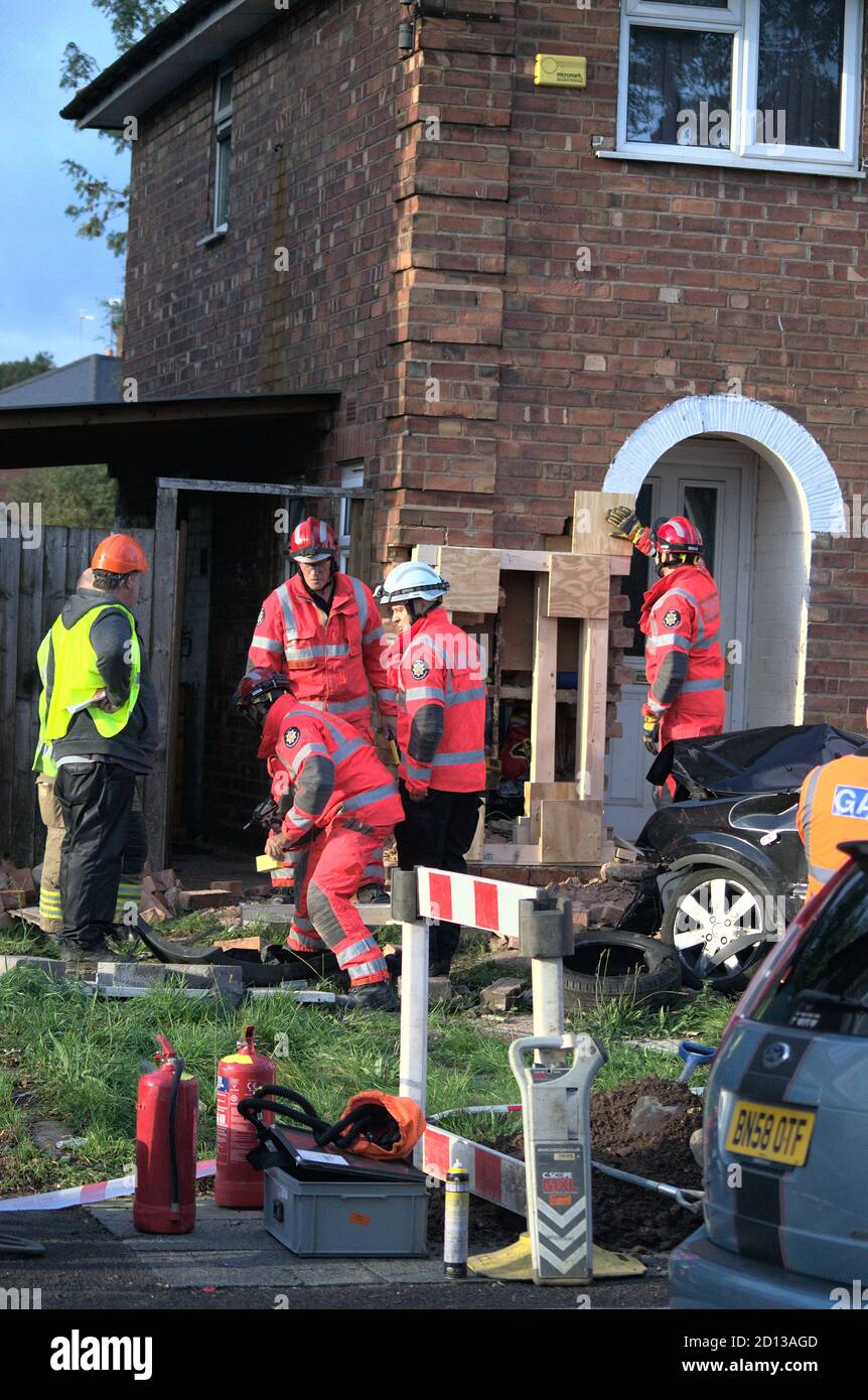 Technical Rescue team from WMFS on the scene after a 15-year old crashed a car into a house in Kingstanding, Birmingham and ruptured a gas main Stock Photo