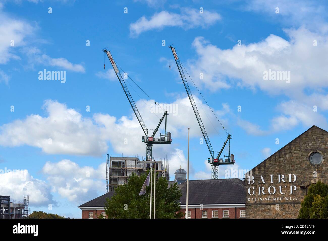 Construction crane jibs in  Leeds city centre, West Yorkshire, northern England, uk Stock Photo