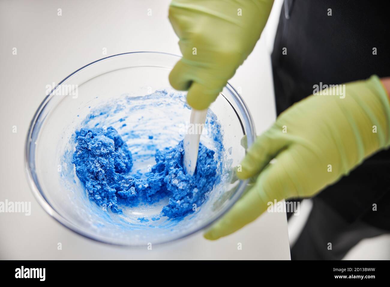 Professional spa worker making a foam for facial treatment Stock Photo