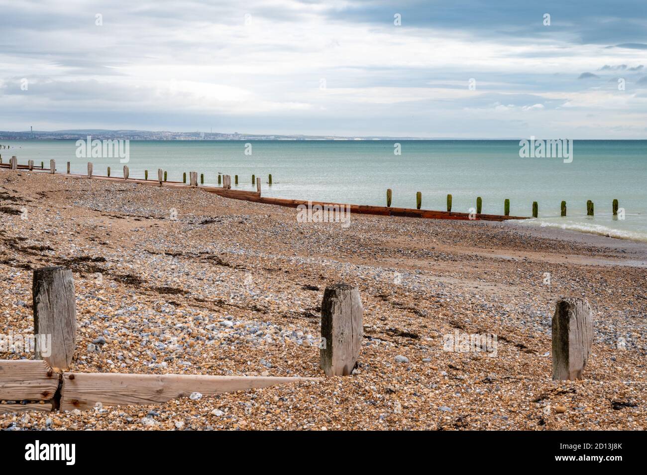 Looking east over the English Channel with Brighton in the distance from Worthing beach, West Sussex, UK. Stock Photo