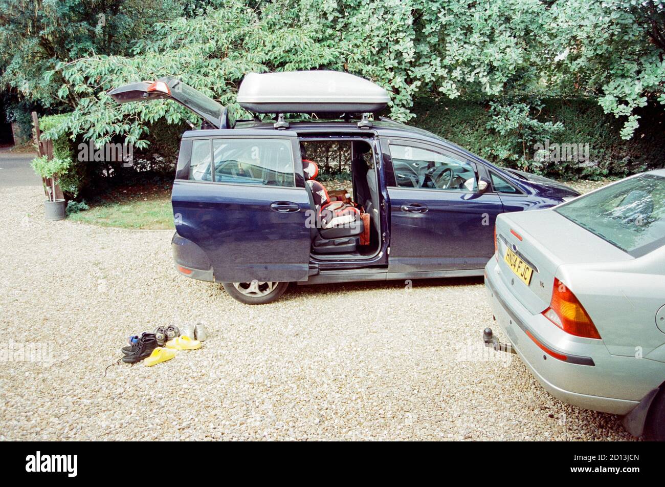 Packing up a family car to go away on holiday, Medstead, Alton, Hampshire, England, united Kingdom. Stock Photo