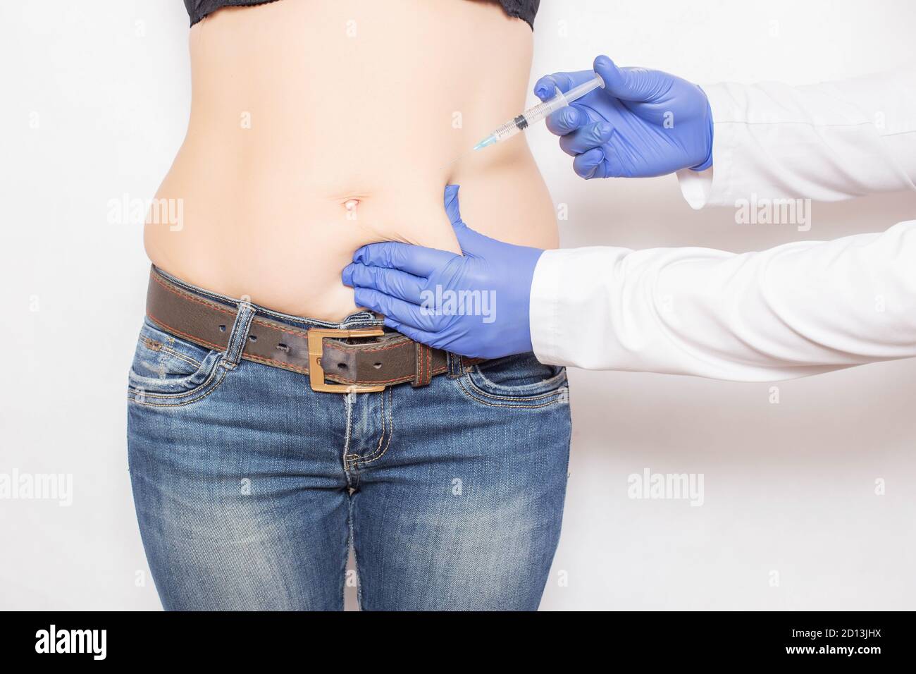 Doctor specialist cosmetologist makes a subcutaneous injection of a drug for weight loss and fat breakdown, mesotherapy Stock Photo