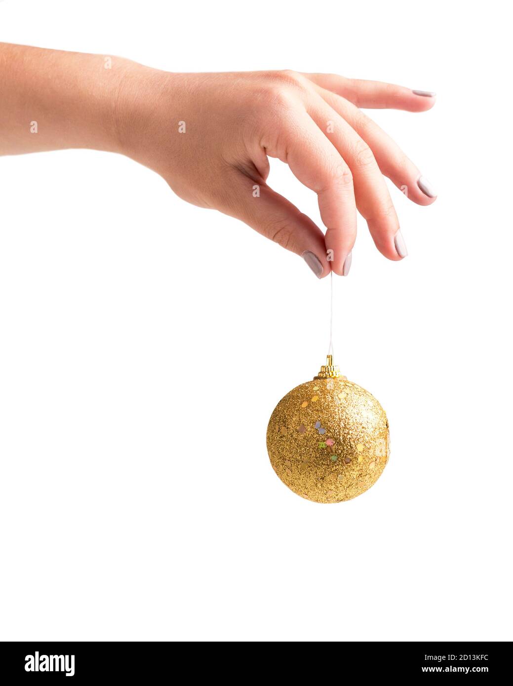 Woman holding golden xmas ball in hand, isolated on white Stock Photo