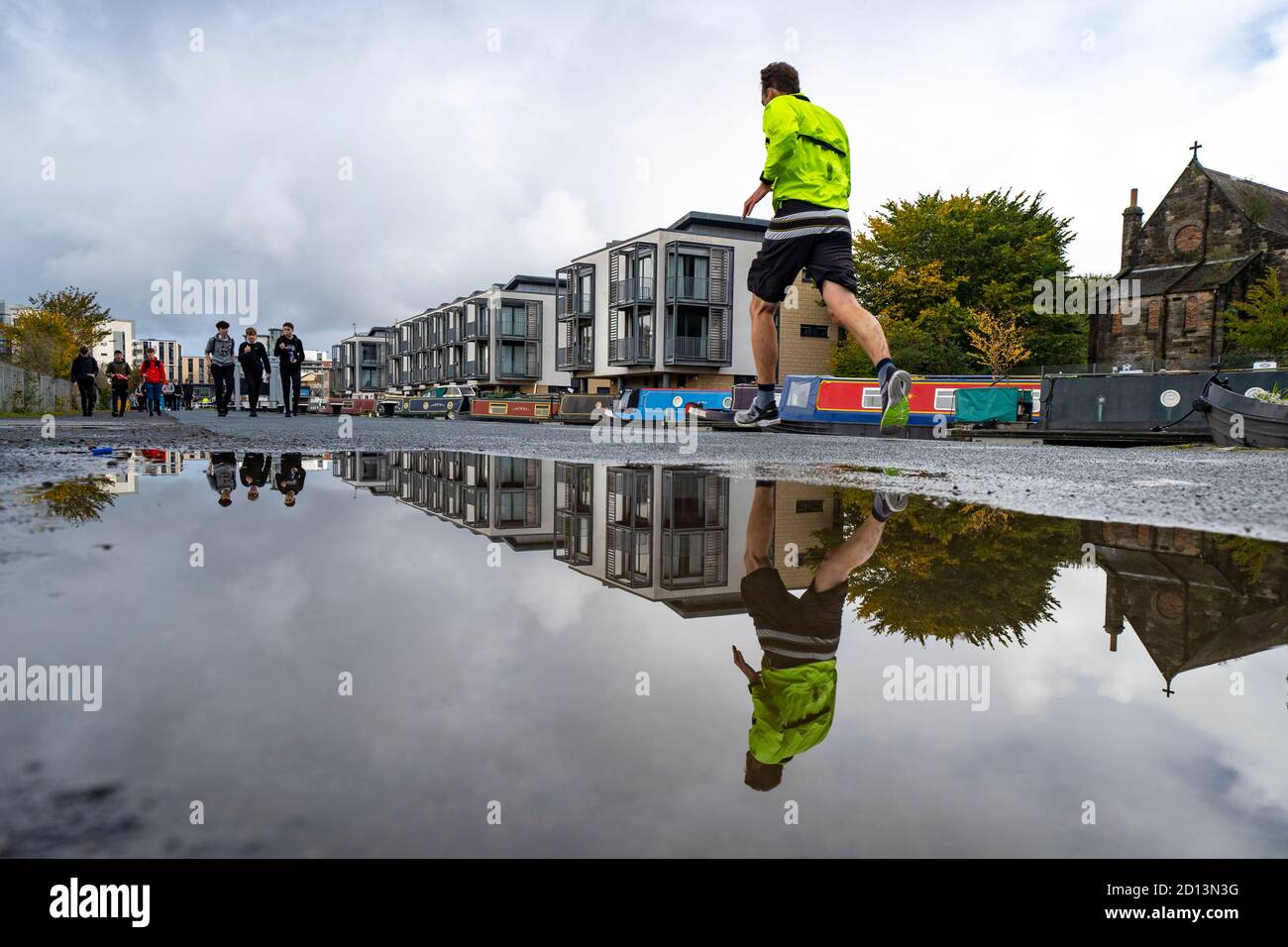 Edinburgh, Scotland, UK. 5 October, 2020. After a weekend of heavy rain from Storm Alex , members of the public were out on the towpath of the Union Canal at Fountainbridge today enjoying some dry, calm weather. Pictured; People exercising beside the Union Canal.  Iain Masterton/Alamy Live News Stock Photo