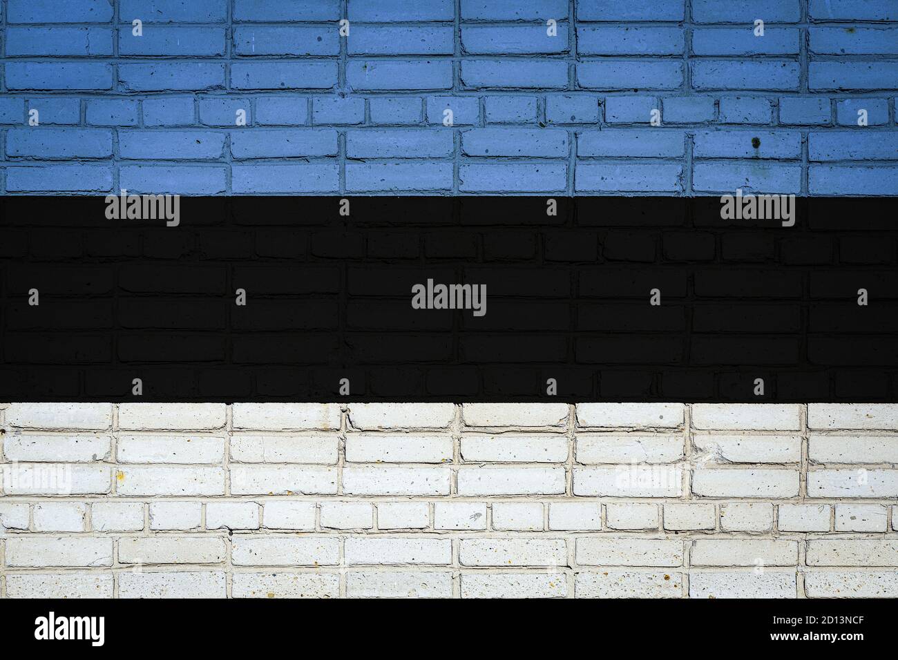 National flag of Estonia depicting in paint colors on an old brick wall ...