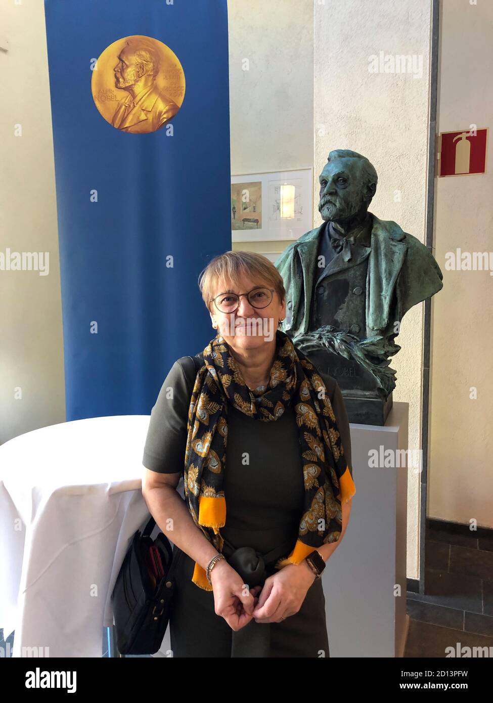 Stockholm, Sweden. 05th Oct, 2020. Maria Masucci, expert of the Nobel Assembly, stands in front of a bust of Alfred Nobel at the Karolinska Institute. (to dpa ''A tremendous leap forward' - Nobel Prize for Virus Researchers' of 05.10.2020) Credit: Steffen Trumpf/dpa/Alamy Live News Stock Photo