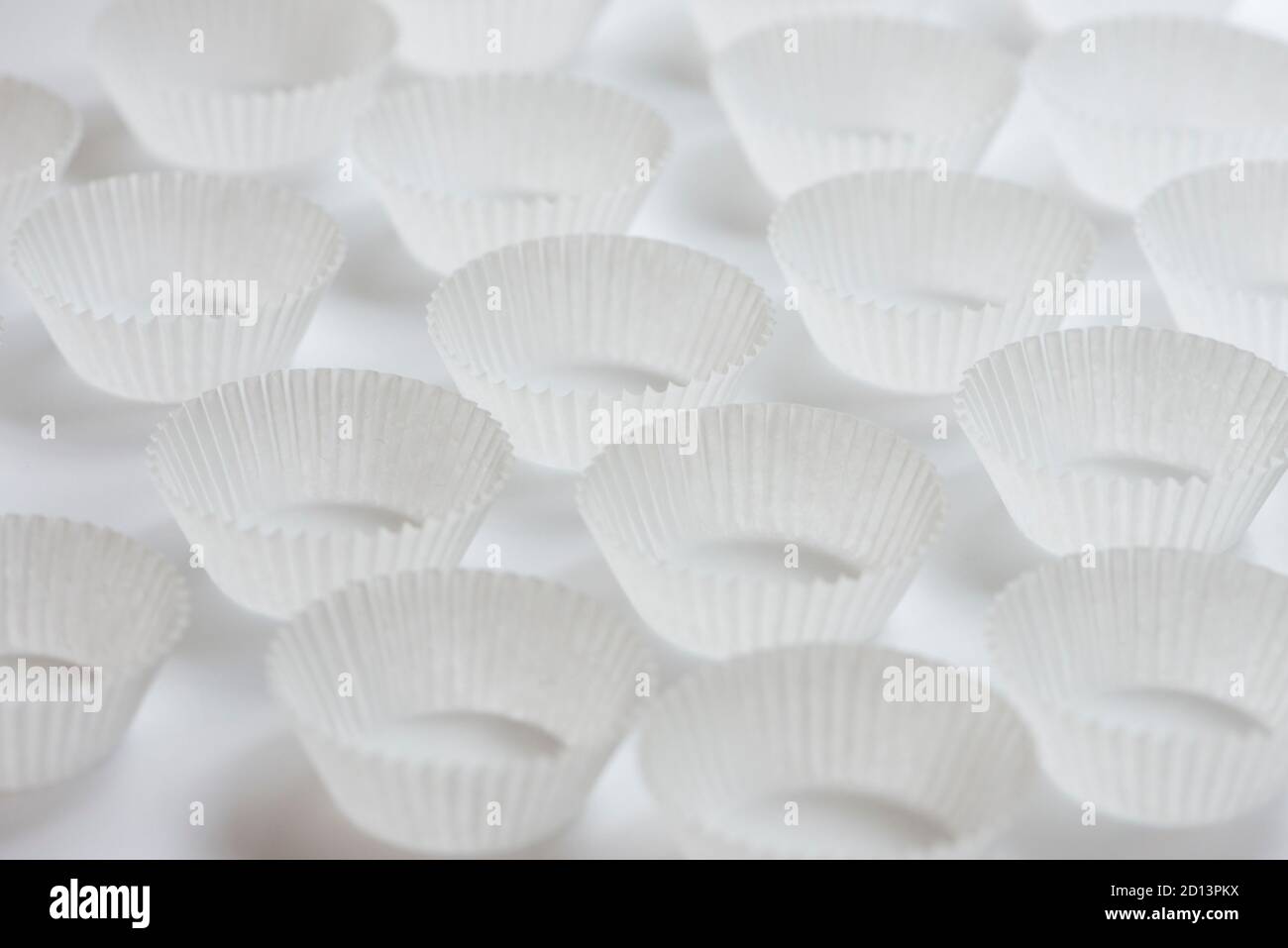 Empty paper cupcakes molds on white background Stock Photo Alamy