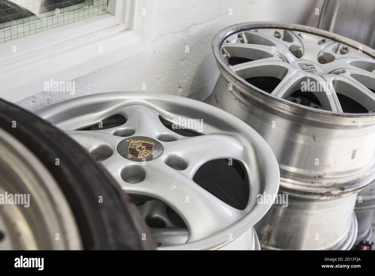 Porsche alloy wheels stacked up, UK, 2015 Stock Photo