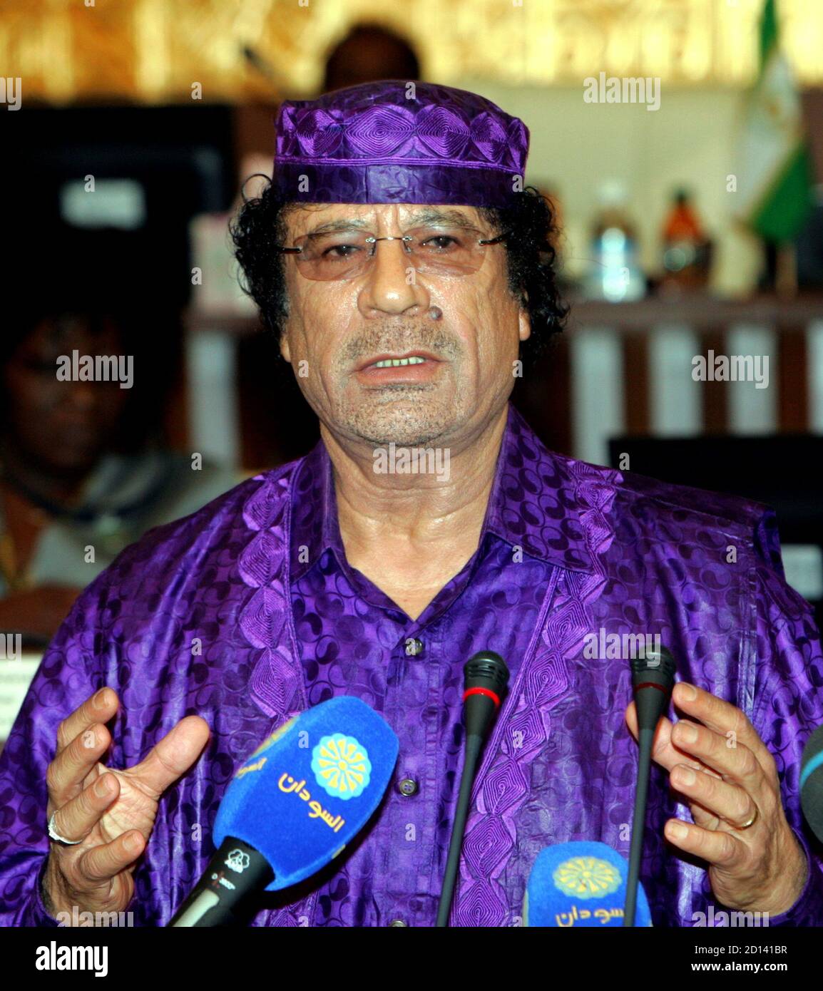 Libyan leader colonel Muammar Gaddafi addresses the media during the official closing ceremony of the Sixth African Union Summit in Sudanese capital Khartoum January 24, 2006. [The African Union on Tuesday chose Congo Republic as a compromise to chair the organisation after Sudan's leadership bid was derailed by fears that its poor human rights record could damage the continent's credibility. Under the deal, Sudan will head the 53-nation body after Congo Republic steps down next year.] Stock Photo
