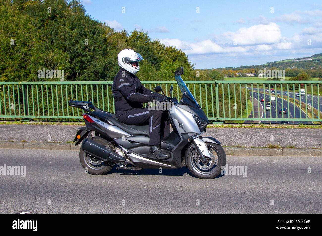 Yamaha X-Max Motorbike rider; two wheeled transport, motorcycles, vehicle, roads, motorbikes, bike riders motoring in Chorley, UK Stock Photo