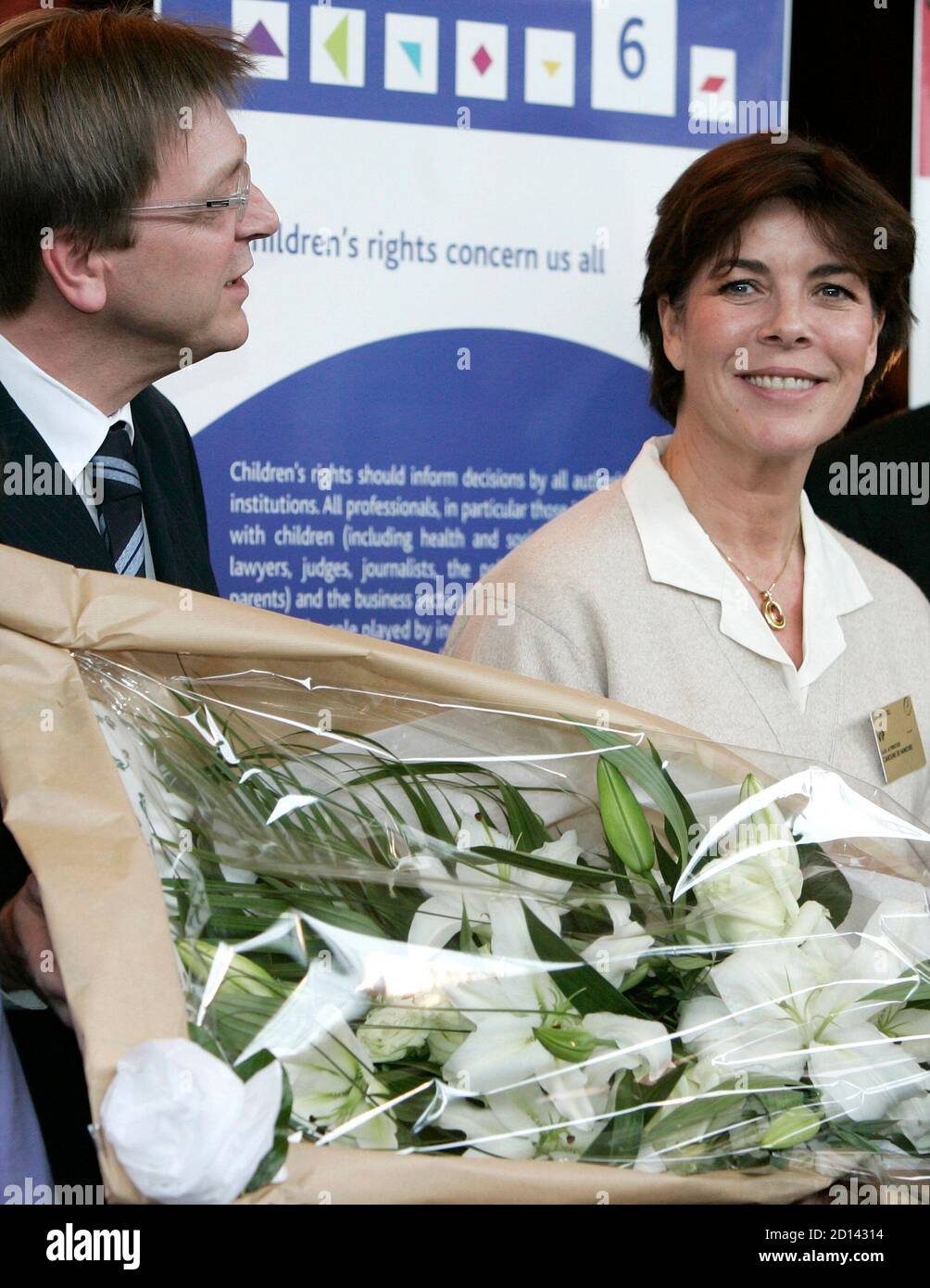 Princess Caroline Of Hanover R President Of The World Association Of Children S Friends Poses With Flowers She Received From Belgian Prime Minister Guy Verhofstadt L On The Occasion Of Her 50th Birthday