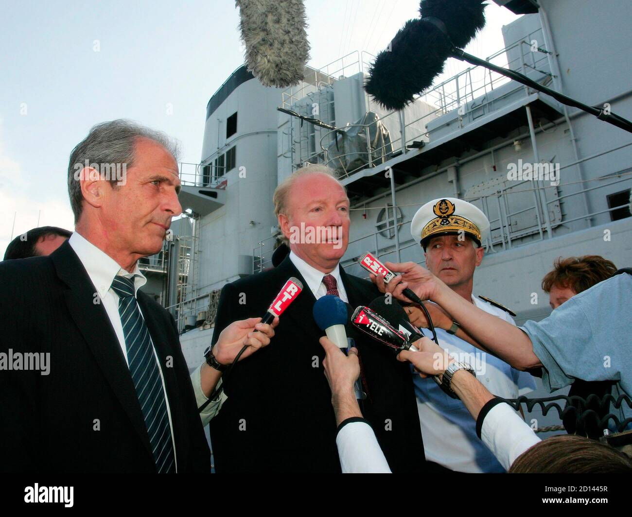 Brice Hortefeux, France's Minister of Immigration, Integration, National  Identity and Co-Development, speaks to the media next to Hubert Falco (L),  Mayor of Touolon and prefet maritime Jean Tandonnet (R) near the French
