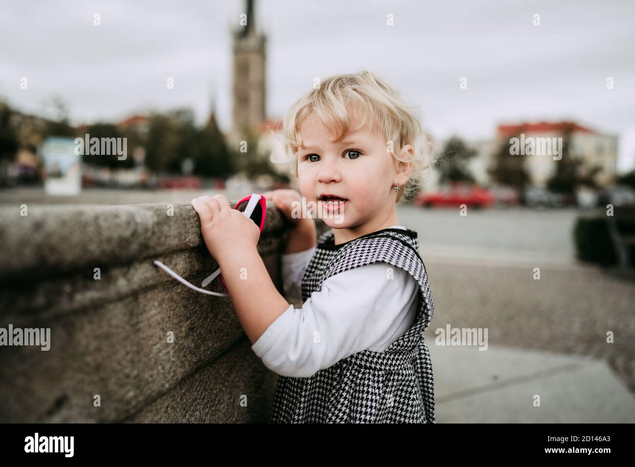 Little girl with sunglasses in city Stock Photo Alamy