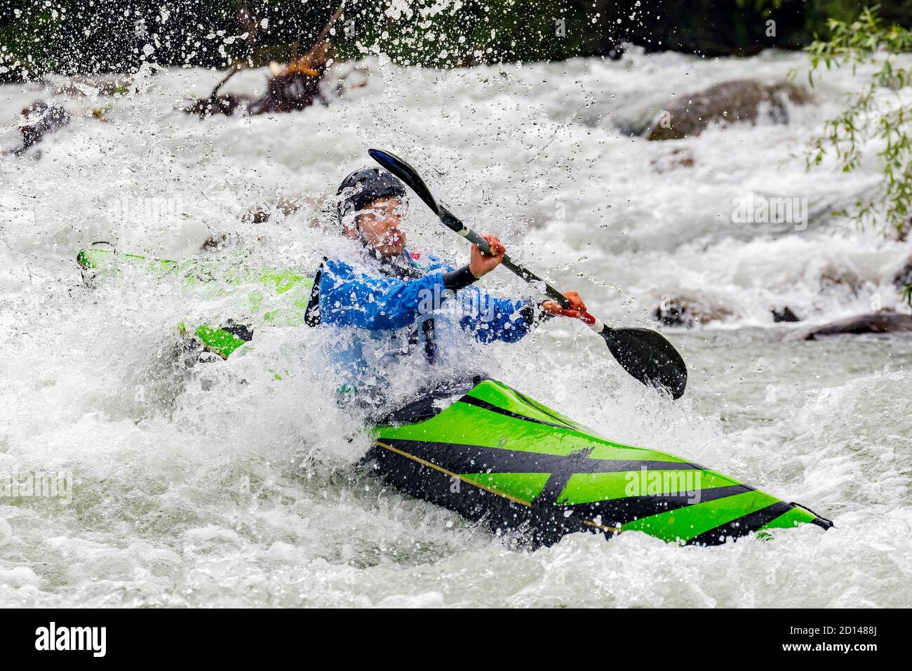 engaged athlete downhill with canoe Stock Photo