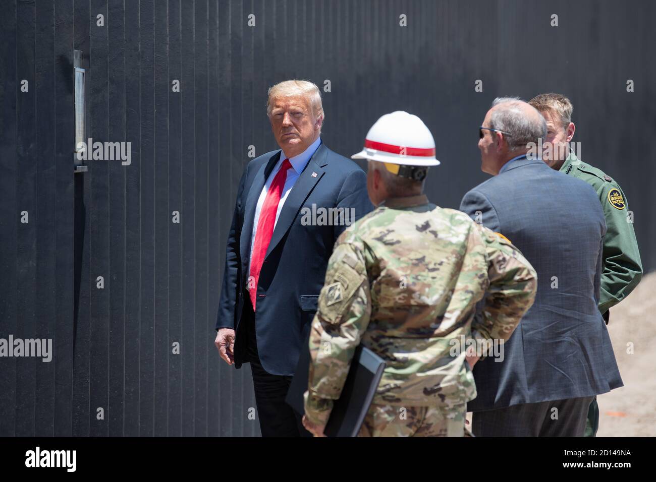 President Donald Trump, along with Acting Secretary Chad Wolf and Acting Commissioner Mark Morgan, visited the border wall in Yuma, Arizona on June 23, 2020. The visit marked the completion of 200 miles of new border wall constructed along the southwest border. Stock Photo